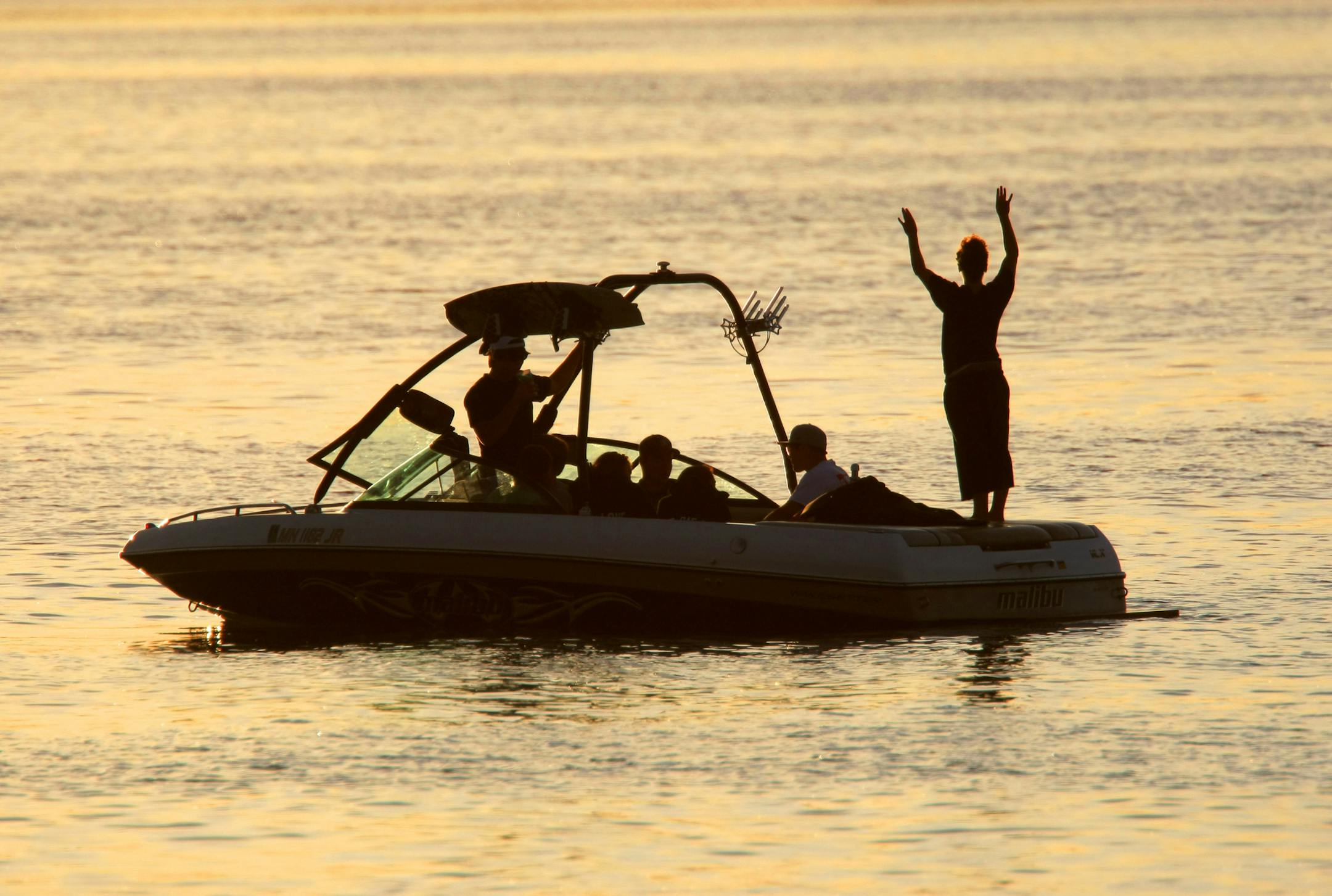 BRIAN PETERSON ï brianp@startribune.com Independence, MN 6/4/2009 ] Despite Minnesotan's love affair with boats, their ability to finance them has cooled. The lakes are quieter, but this group found reason to party on a beautiful evening on Lake Independence Wednesday evening.