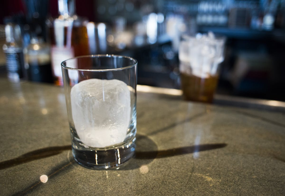 A cylinder ice form awaits a cocktail at the Eat Street Social.
