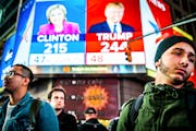 People watch election results at Times Square in New York, Nov. 9, 2016. Clinton has followed Al Gore as the second Democratic presidential candidate 