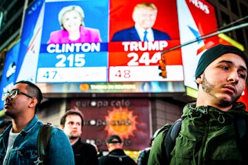 People watch election results at Times Square in New York, Nov. 9, 2016. Clinton has followed Al Gore as the second Democratic presidential candidate 