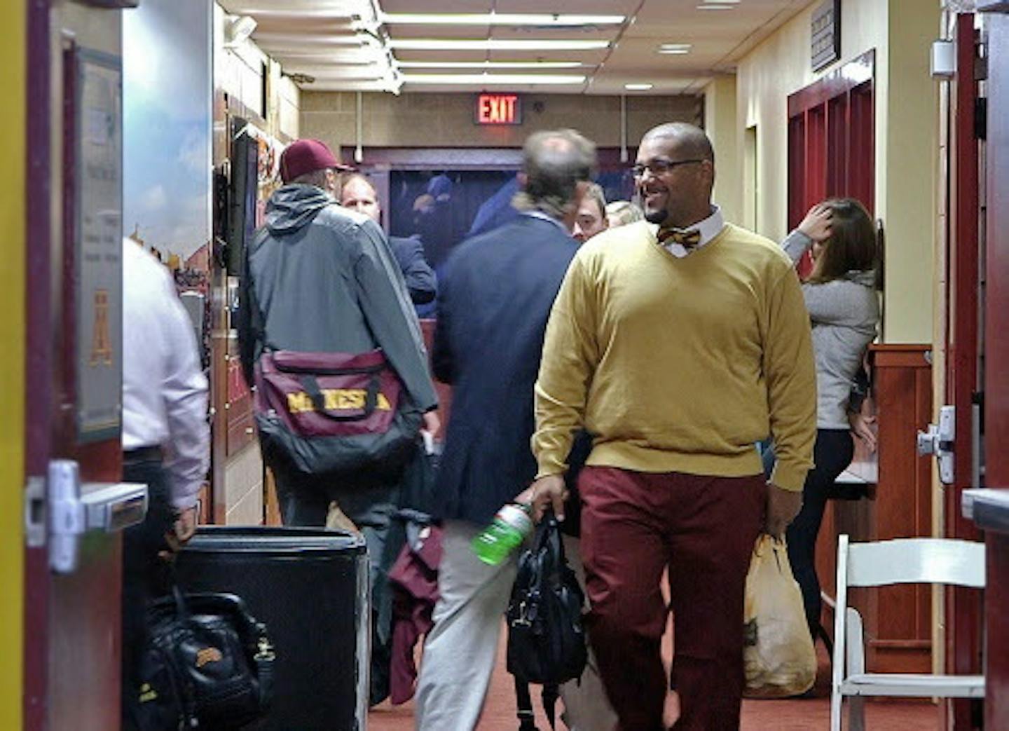 In this 2014 photo, Gophers linebackers coach Mike Sherels got ready to board a team bus. Sherels underwent multiple surgeries and won't be on the sideline to start the season.