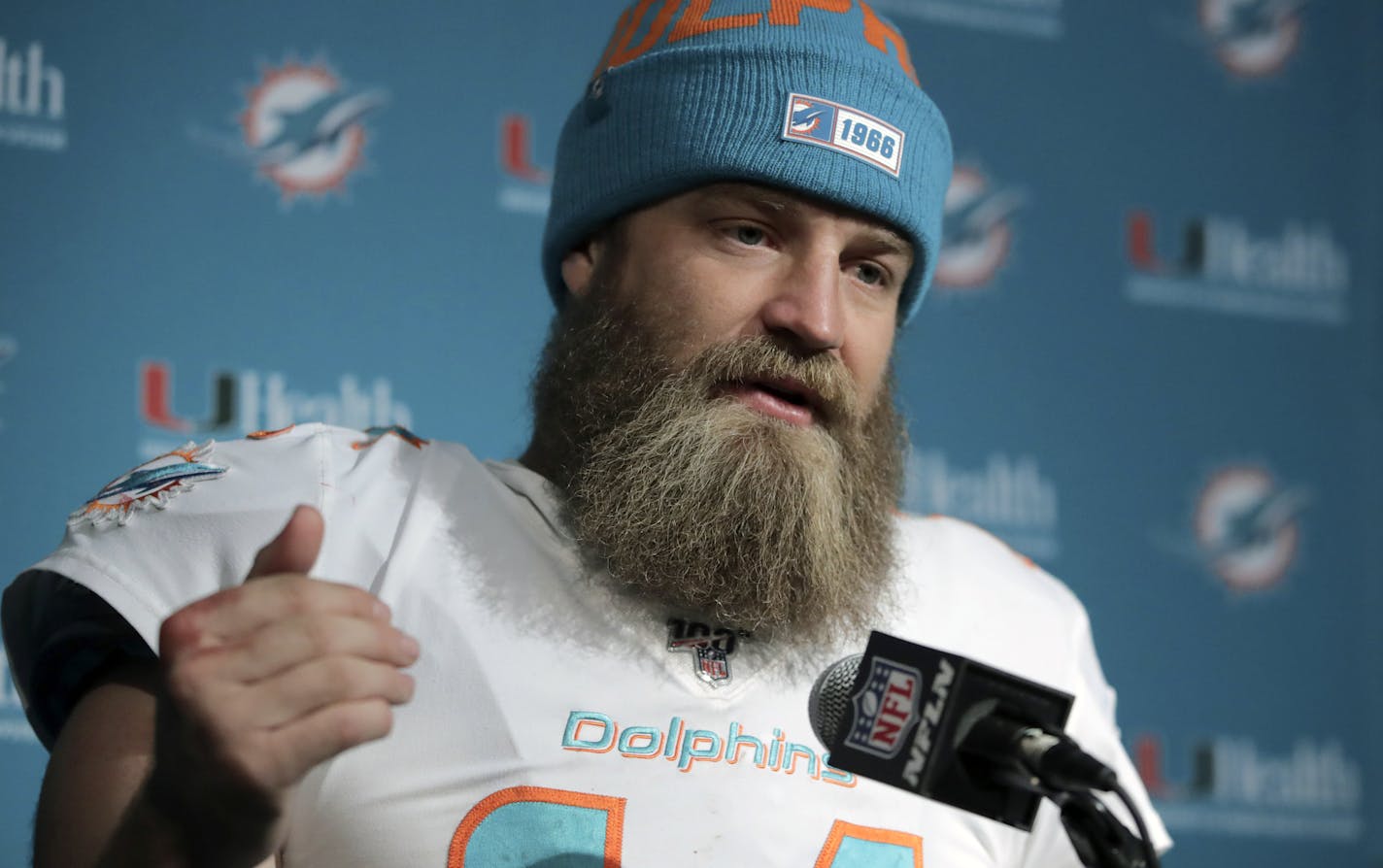 FILE - In this Dec. 29, 2019, file photo, Miami Dolphins quarterback Ryan Fitzpatrick speaks to the media following an NFL football game against the New England Patriots in Foxborough, Mass. Quarterback facial hair is sure to be front and center when the Jacksonville Jaguars (1-1) host the Miami Dolphins (0-2) on Thursday night, Sept. 24, 2020. Miami's Ryan Fitzpatrick has a bushy beard that covers much of his face and engulfs his chin strap; Jacksonville's Gardner Minshew has a unkept horseshoe