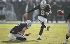 Oakland Raiders kicker Daniel Carlson (8) kicks a field goal from the hold of Johnny Townsend during the first half of an NFL football game against th