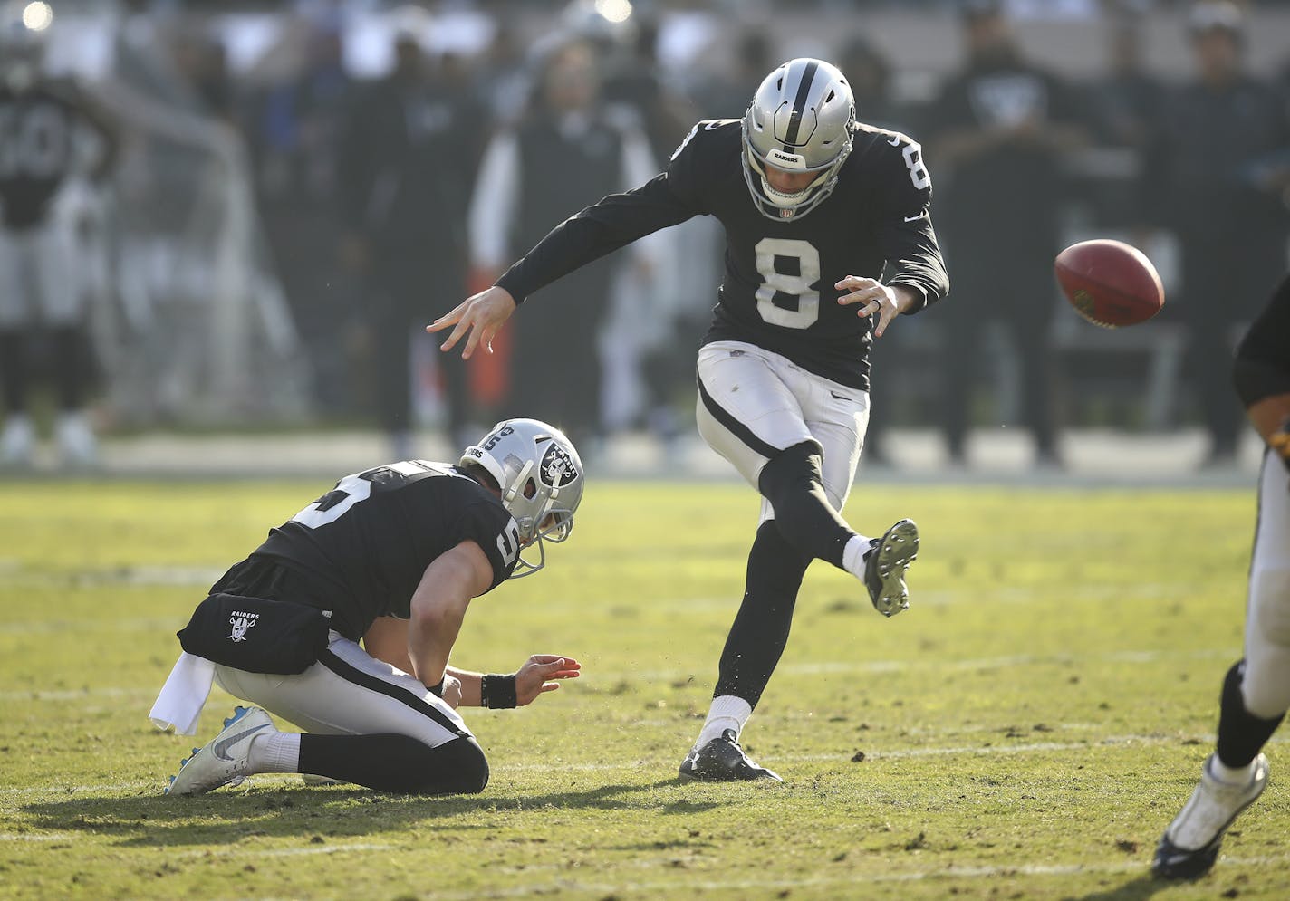 Oakland Raiders kicker Daniel Carlson (8) kicks a field goal from the hold of Johnny Townsend during the first half of an NFL football game against the Pittsburgh Steelers in Oakland, Calif., Sunday, Dec. 9, 2018. (AP Photo/Ben Margot)