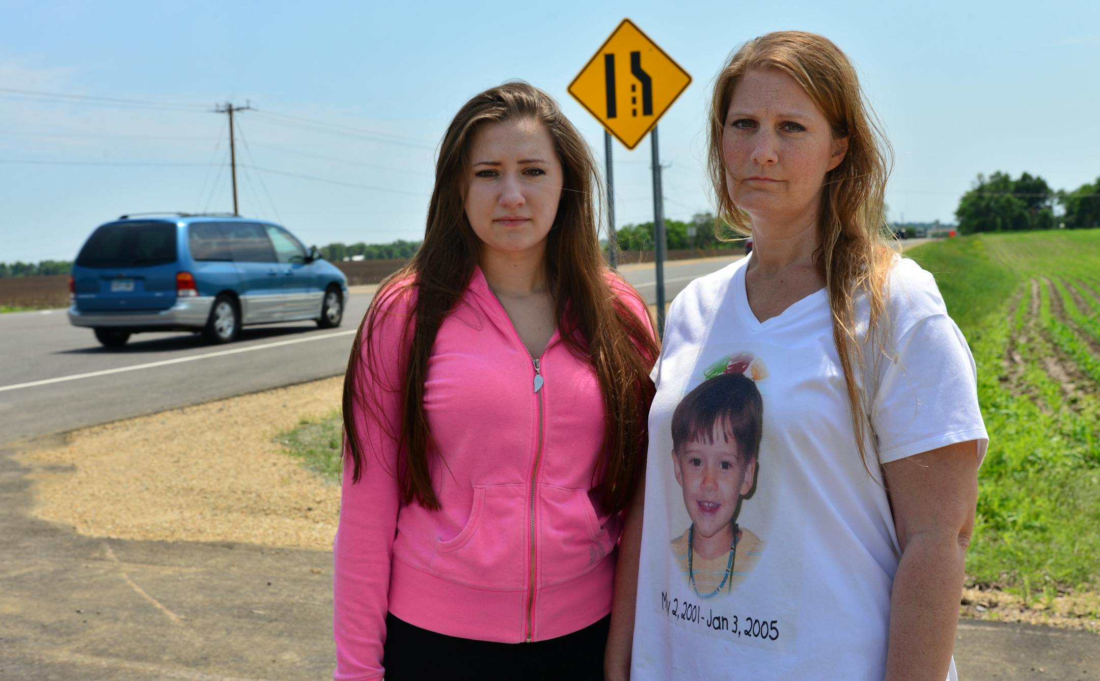 Angela Scheller-Eppler and her daughter Sierra outside St. Ambrose School in Woodbury on County Road 19 (Woodbury Drive) where her son Wyatt, 3, was killed in a bus collision in 2005. ] County commissioners take up the issue of traffic safety on county roads that pass schools, in part responding to concerns from a Cottage Grove mother that a school speed limit was removed from a road where her son was killed in 2005. The proliferation of charter and private schools has put more pressure on the c