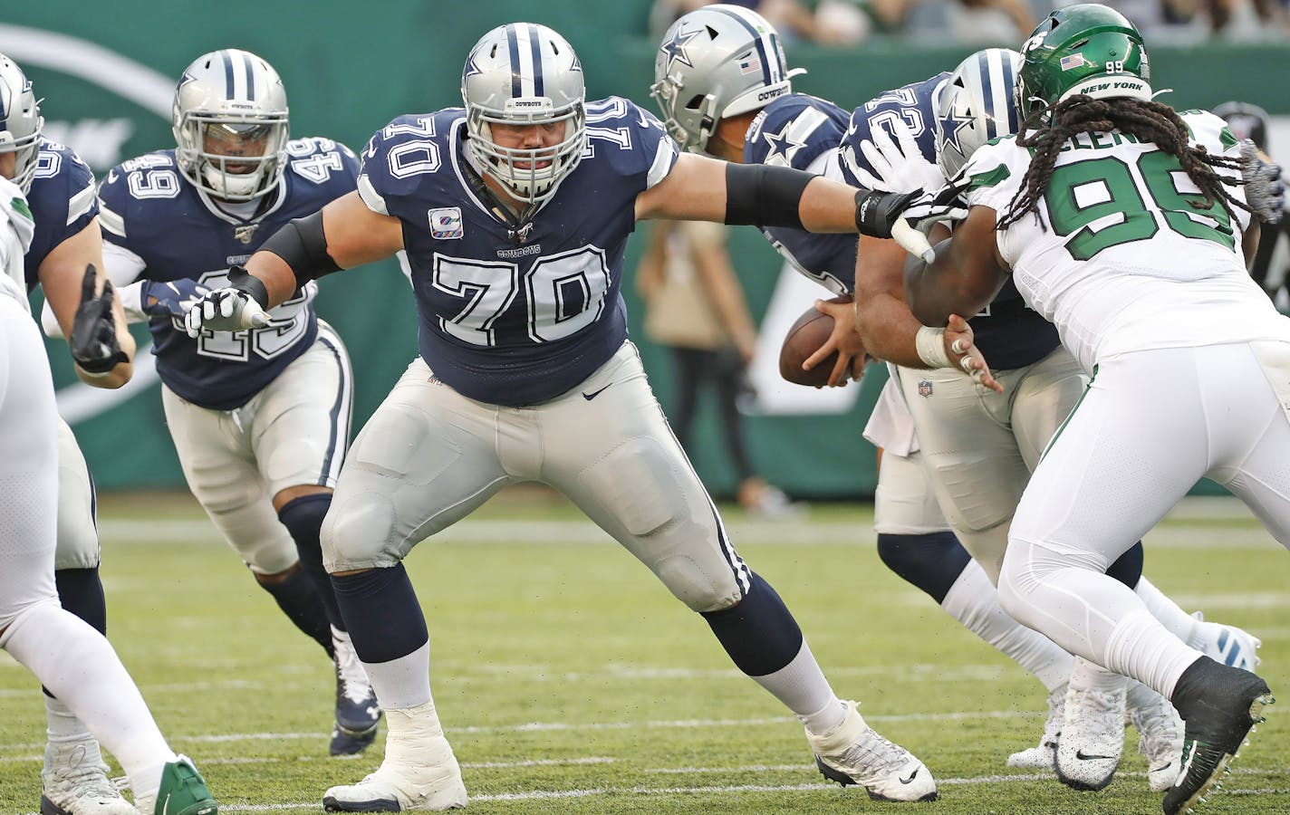 Dallas Cowboys offensive guard Zack Martin (70) blocks during an NFL football game against the New York Jets, Sunday, Oct. 13, 2019, in East Rutherford, NJ. The Jets defeated the Cowboys, 24-22. (James D. Smith via AP) ORG XMIT: FBNCTR