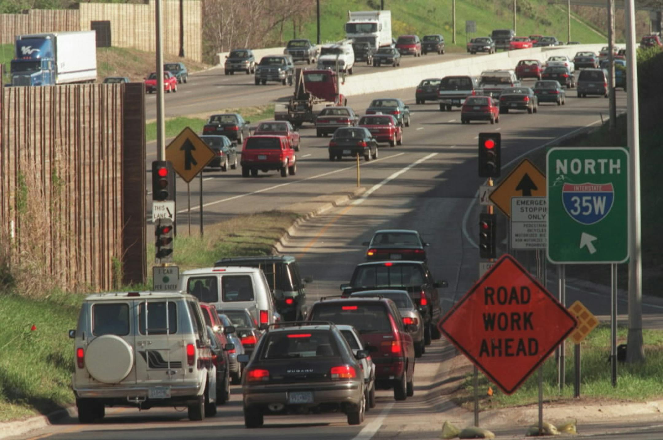Drivers wait at a ramp meter leading to I-35W in Minneapolis. Meters space out traffic entering the freeway helping to relieve congestion.