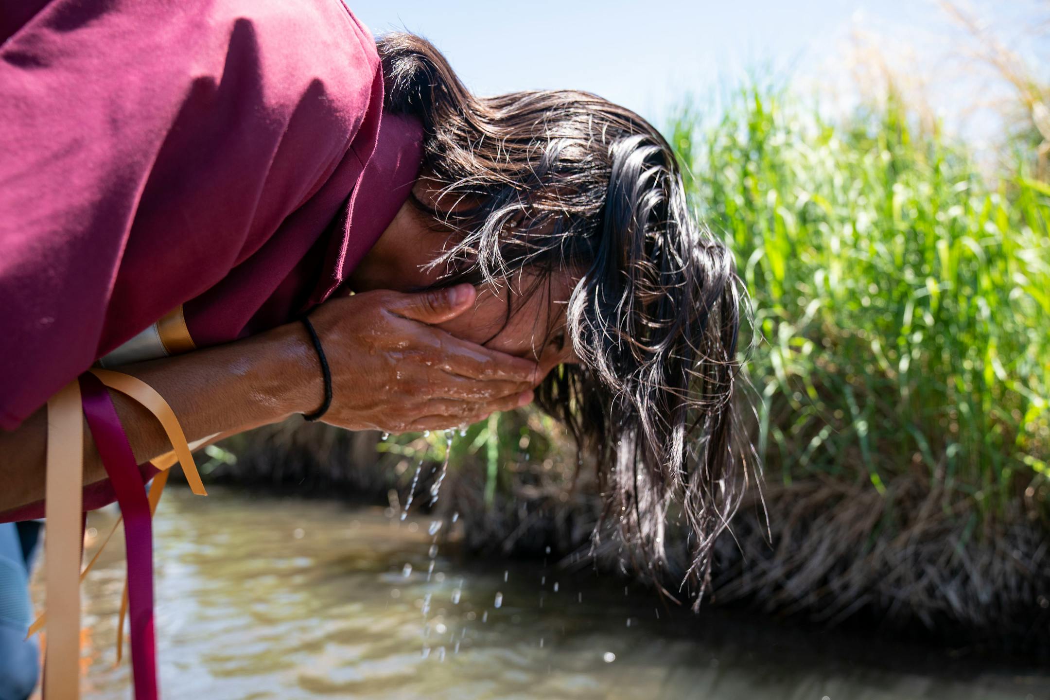 Darius Lambert,  a member of the Eastern band of the Cherokee Nation in North Carolina, washed his face in the Mississippi River on Monday.
