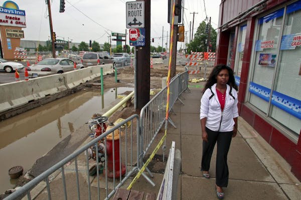 Biftu Merdassa walked along an area under construction for the Central Corridor light-rail line outside her shop on University Avenue in St. Paul.