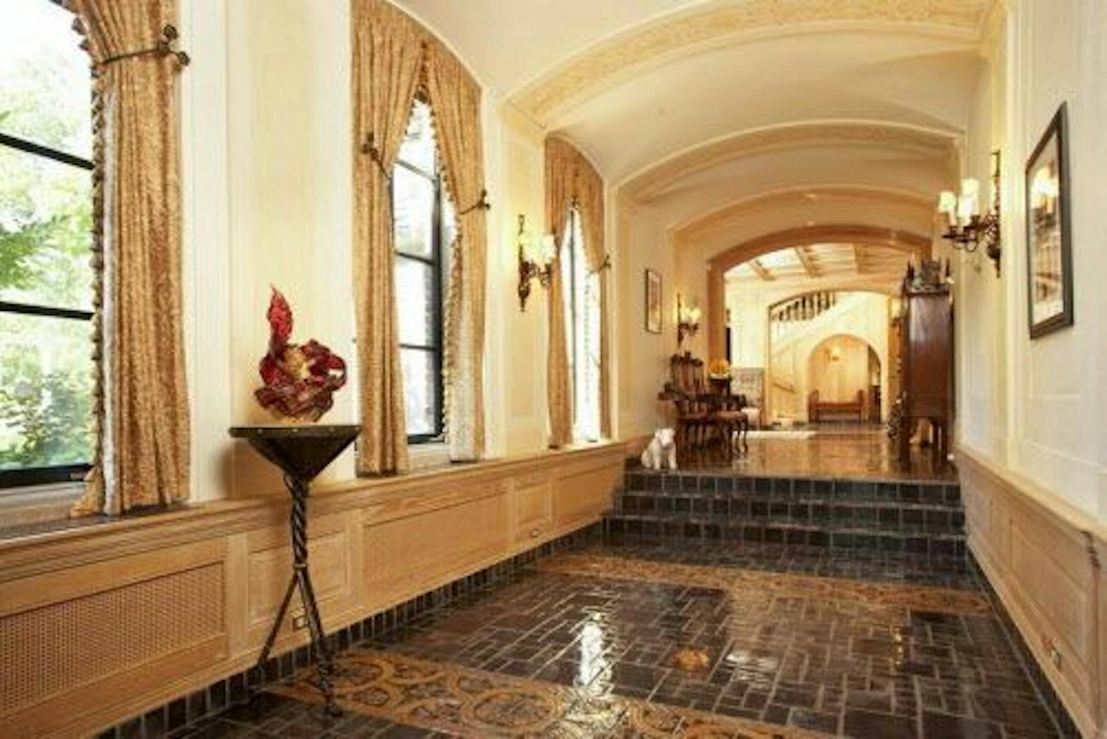 Hallway with tiled floor.