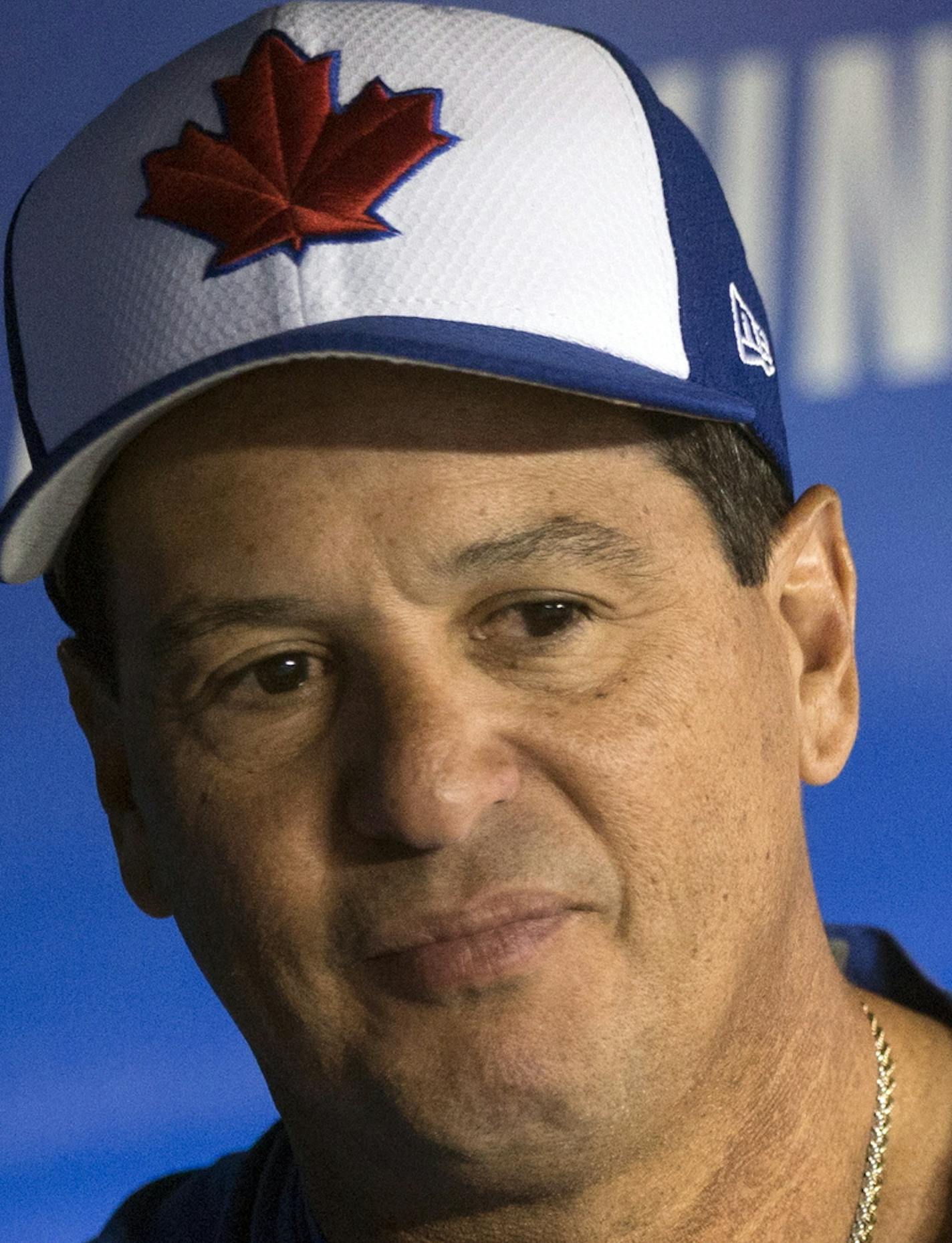 Toronto Blue Jays manager Charlie Montoyo sits in the dugout following a baseball workout in Toronto, Wednesday, March 27, 2019. The Blue Jays host the Detroit Tigers on opening day Thursday. (Chris Young/The Canadian Press via AP)