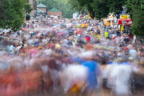 Thousands of fairgoers walk along Judson Ave. Thursday.