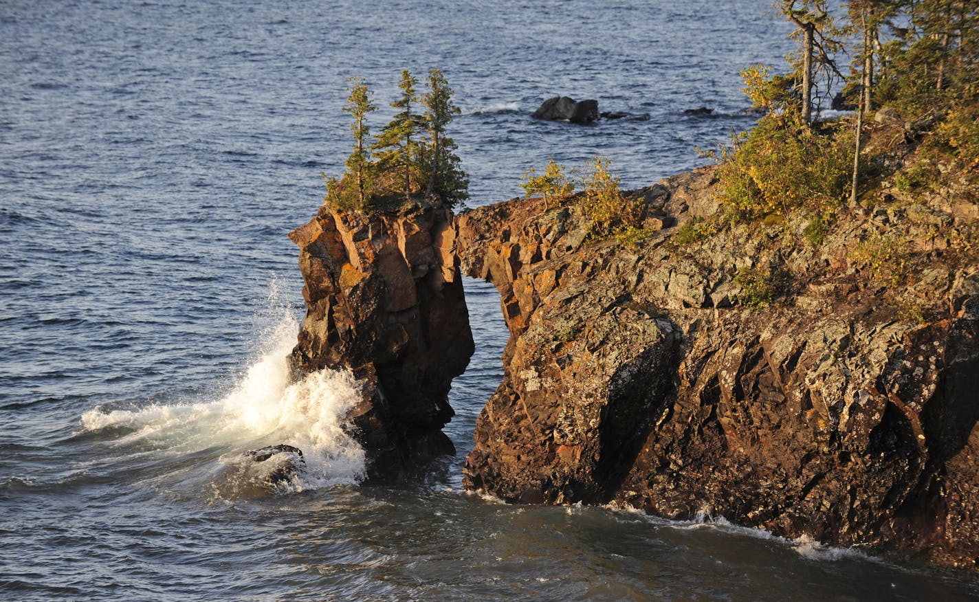 In a Sept. 30, 2009 photo, a wave smashes into the rock at Tettegouche State Park along the shoreline of the North Shore of Lake Superior in Minnesota. (AP Photo/Jim Mone) ORG XMIT: APSTK