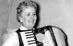 Coya Knutson played the accordion as she awaited primary returns in 1958.