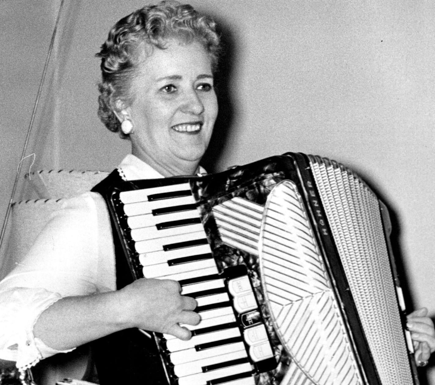 Coya Knutson played the accordion as she awaited primary returns in 1958.