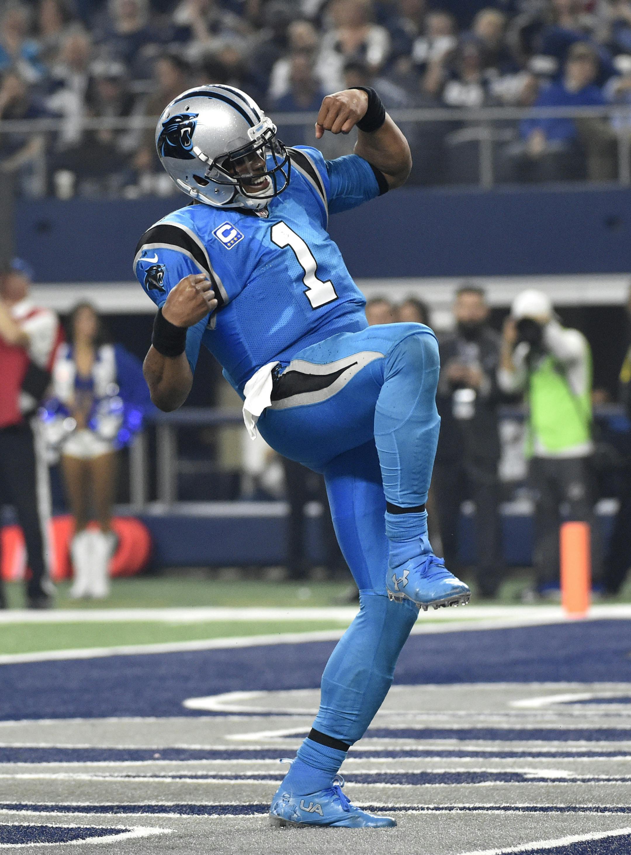 Carolina Panthers' Cam Newton (1) celebrates after rushing for a touchdown against the Dallas Cowboys in an NFL football game, Thursday, Nov. 26, 2015, in Arlington, Texas. (AP Photo/Michael Ainsworth) ORG XMIT: OTKTG262