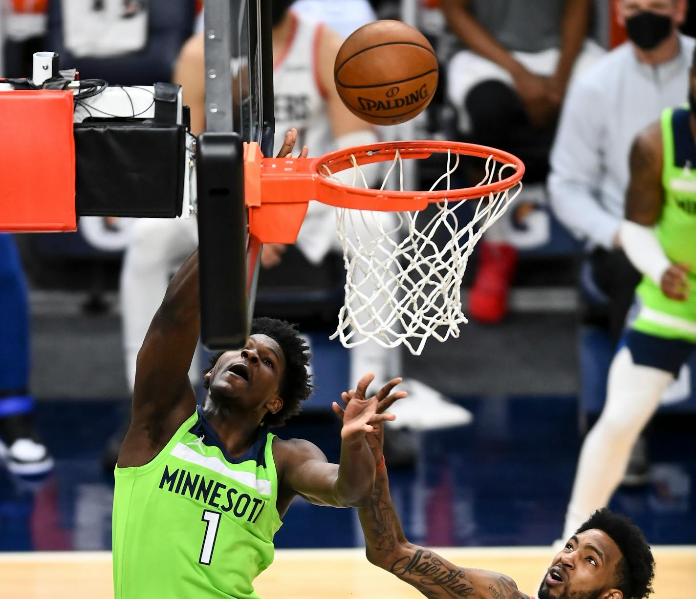 Minnesota Timberwolves forward Anthony Edwards (1) was fouled on his way to the rim by Portland Trail Blazers forward Derrick Jones Jr. (55) in the second half. ] AARON LAVINSKY • aaron.lavinsky@startribune.com