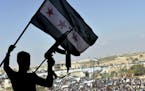 Thousands of protesters attend a demonstration against the Syrian government offensive to Idlib, in the northwestern town of Maarat al-Numan, also kno