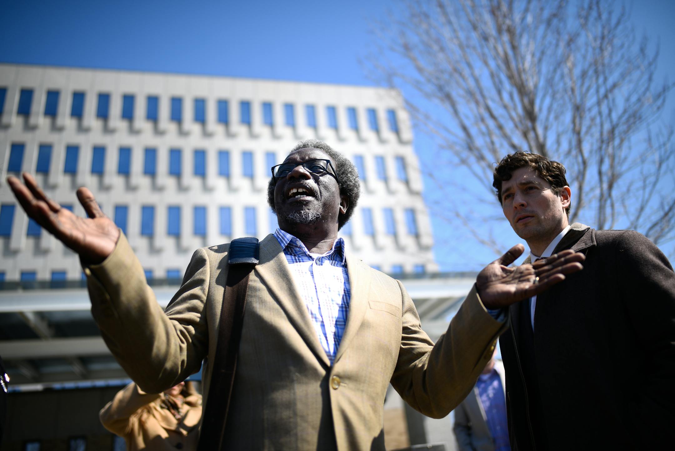 Augsburg Professor Mzenga Wanyama stood beside Minneapolis Mayor Jacob Frey as Wanyama addressed supporters who were demonstrating outside the Immigration and Customs Enforcement headquarters Thursday on his behalf Thursday. ] AARON LAVINSKY ï aaron.lavinsky@startribune.com Augsburg Professor Mzenga Wanyama and his wife Mary returned to Immigration and Customs Enforcement headquarters Thursday, April 5, 2018 for another check-in to discuss the agency's plan to deport them. Wanyama emerged t
