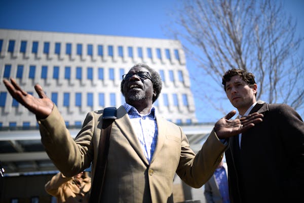 Augsburg Professor Mzenga Wanyama stood beside Minneapolis Mayor Jacob Frey as Wanyama addressed supporters who were demonstrating outside the Immigra