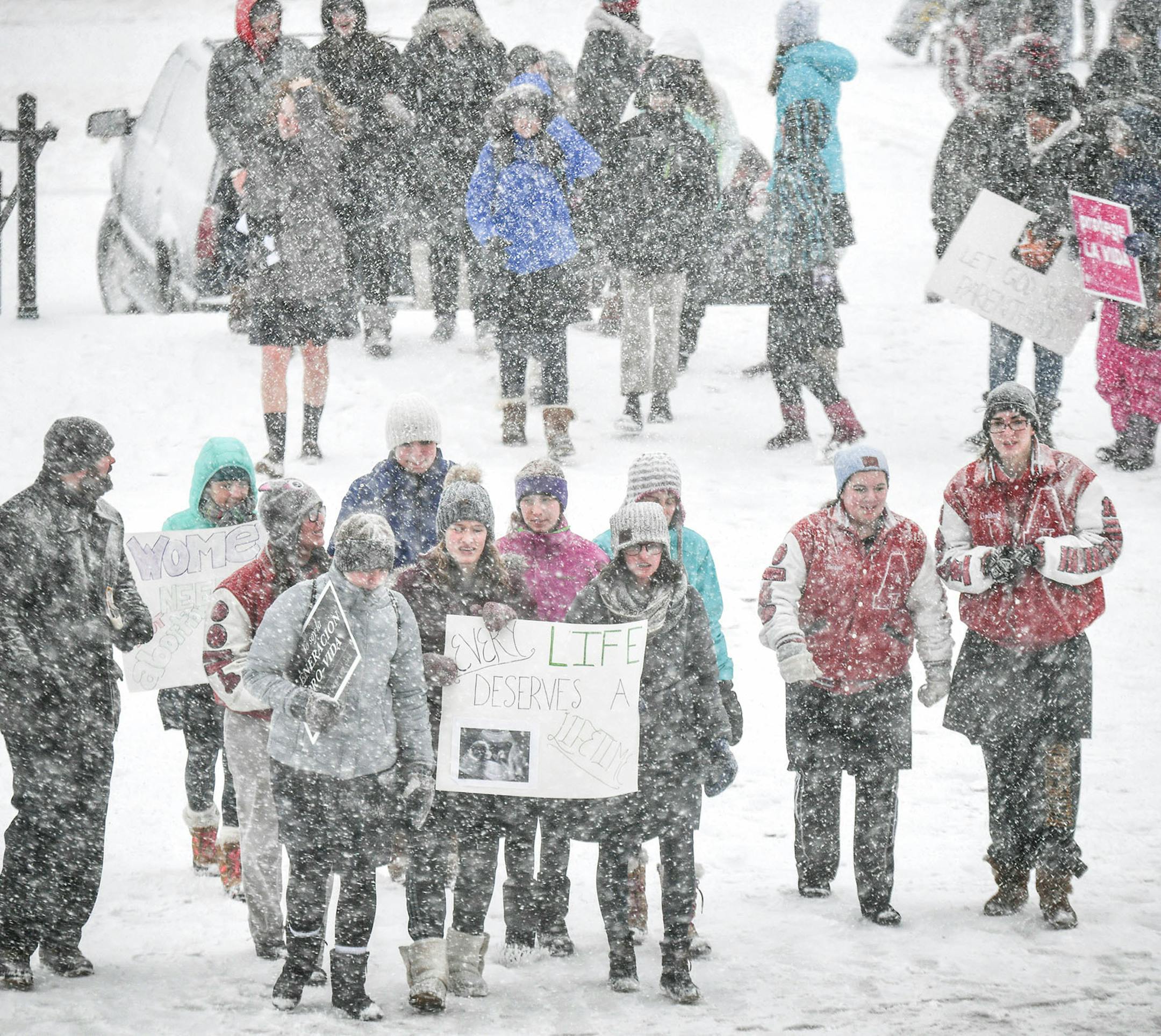The March for Life had to be moved from the Capitol steps to inside and heavy snow moved through the Twin Cities. .