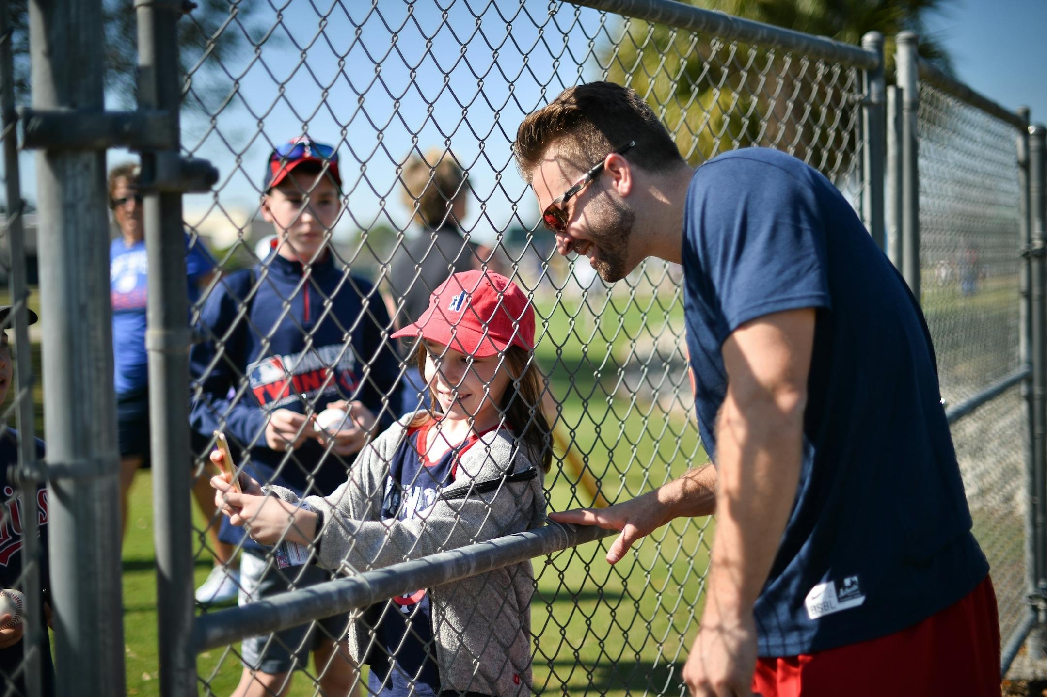 Minnesota Twins second baseman Brian Dozier (2) took a selfie with a young fan Friday.