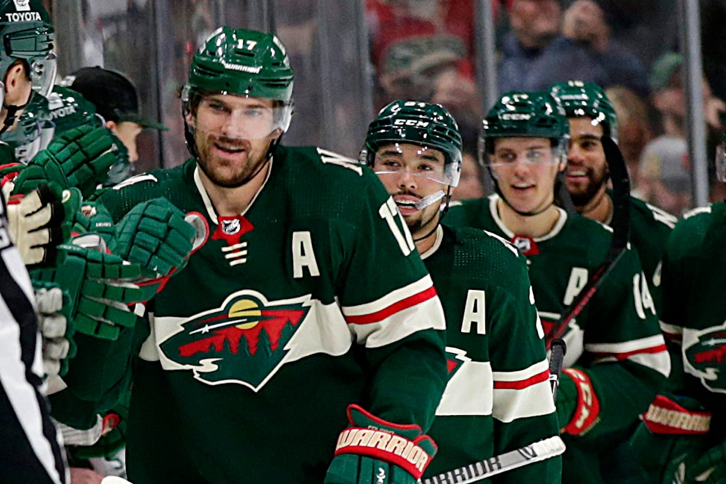 Marcus Foligno (17), Matt Dumba (24), Joel Eriksson Ek (14) and Jordan Greenway (18) receive congratulations after a goal against the Toronto Maple Leafs