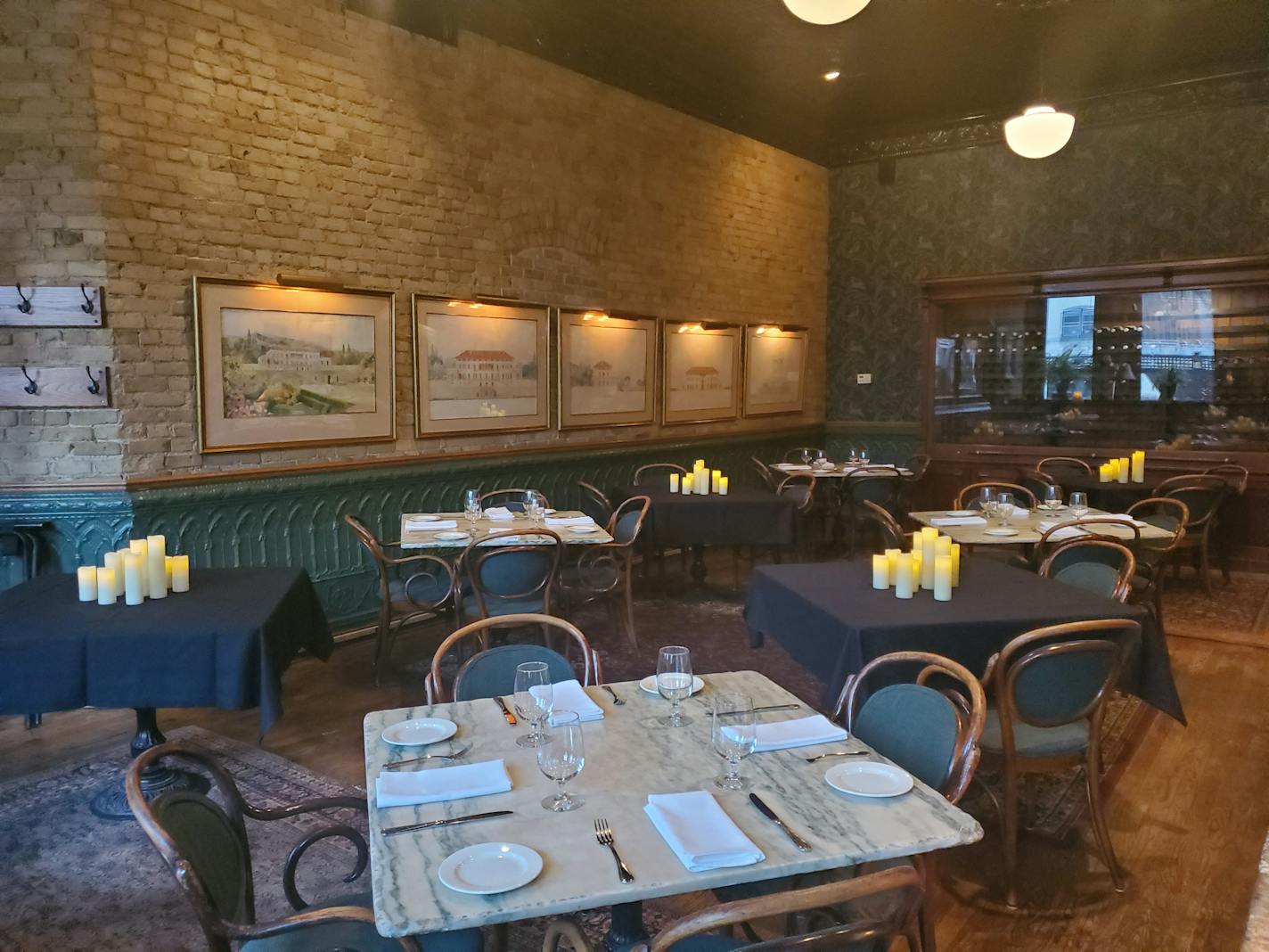 To practice social distancing, St. Paul restaurants W.A. Frost and the Commodore are rearranging dining rooms to keep guests six feet apart. The tables in between are now covered with black tablecloths and candles.