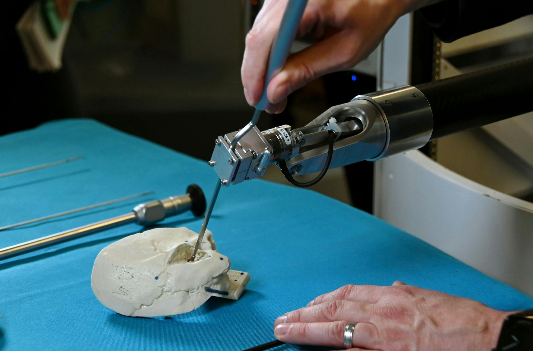 David Saunders, CTO and co-founder of Galen Robotics. demonstrates the Galen Robot using a model of a mastoid bone. The robot assists surgeons with microsurgeries by reducing hand tremors. The company, incubated at Johns Hopkins University, is poised for a big expansion in Pigtown. (Kim Hairston/Baltimore Sun/TNS) ORG XMIT: 1482018
