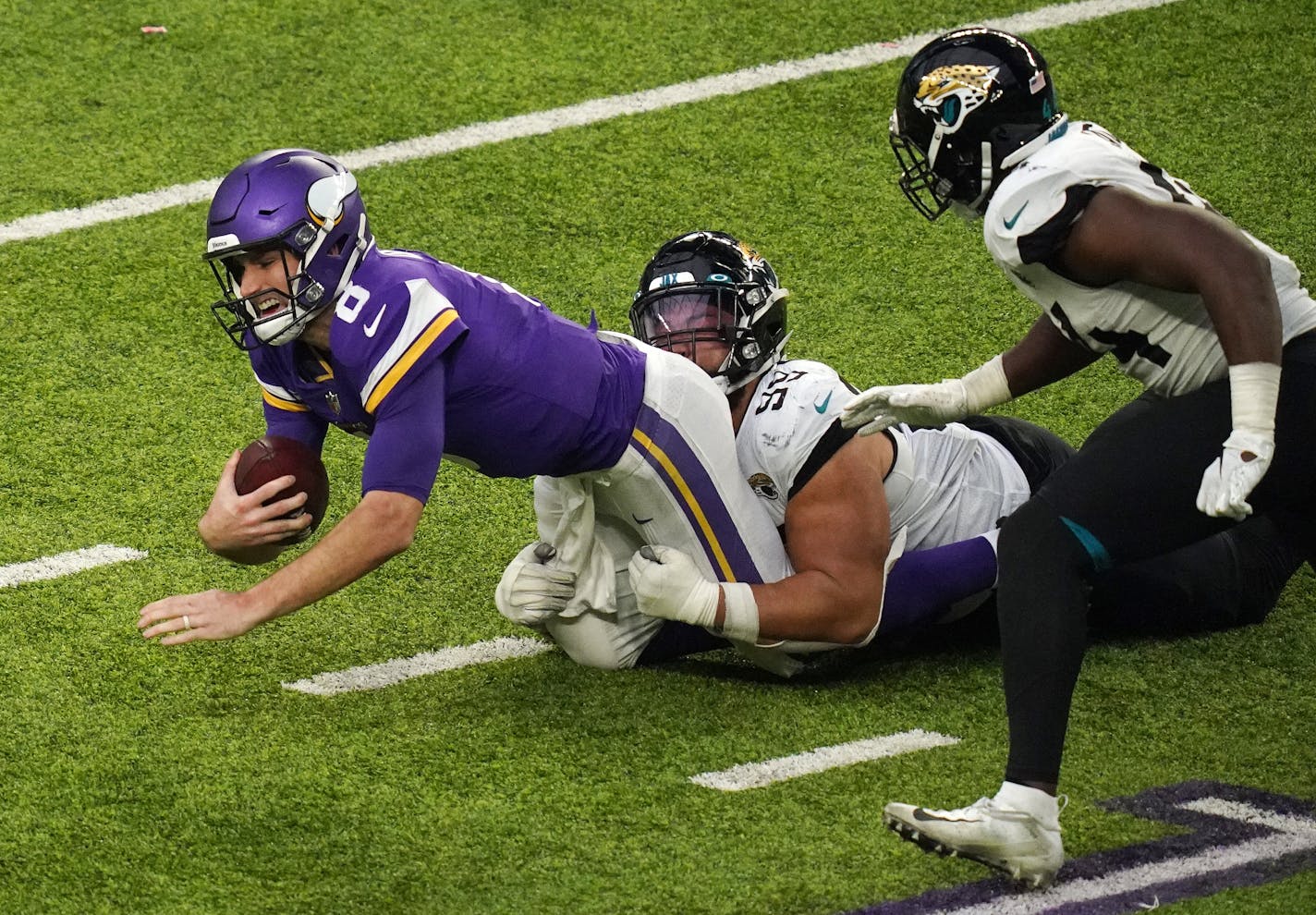 Vikings quarterback Kirk Cousins was sacked by Jaguars defensive tackle Rodney Gunter (99) in the fourth quarter Sunday. Cousins will face even more pressure from blitz-happy Tampa Bay this week.