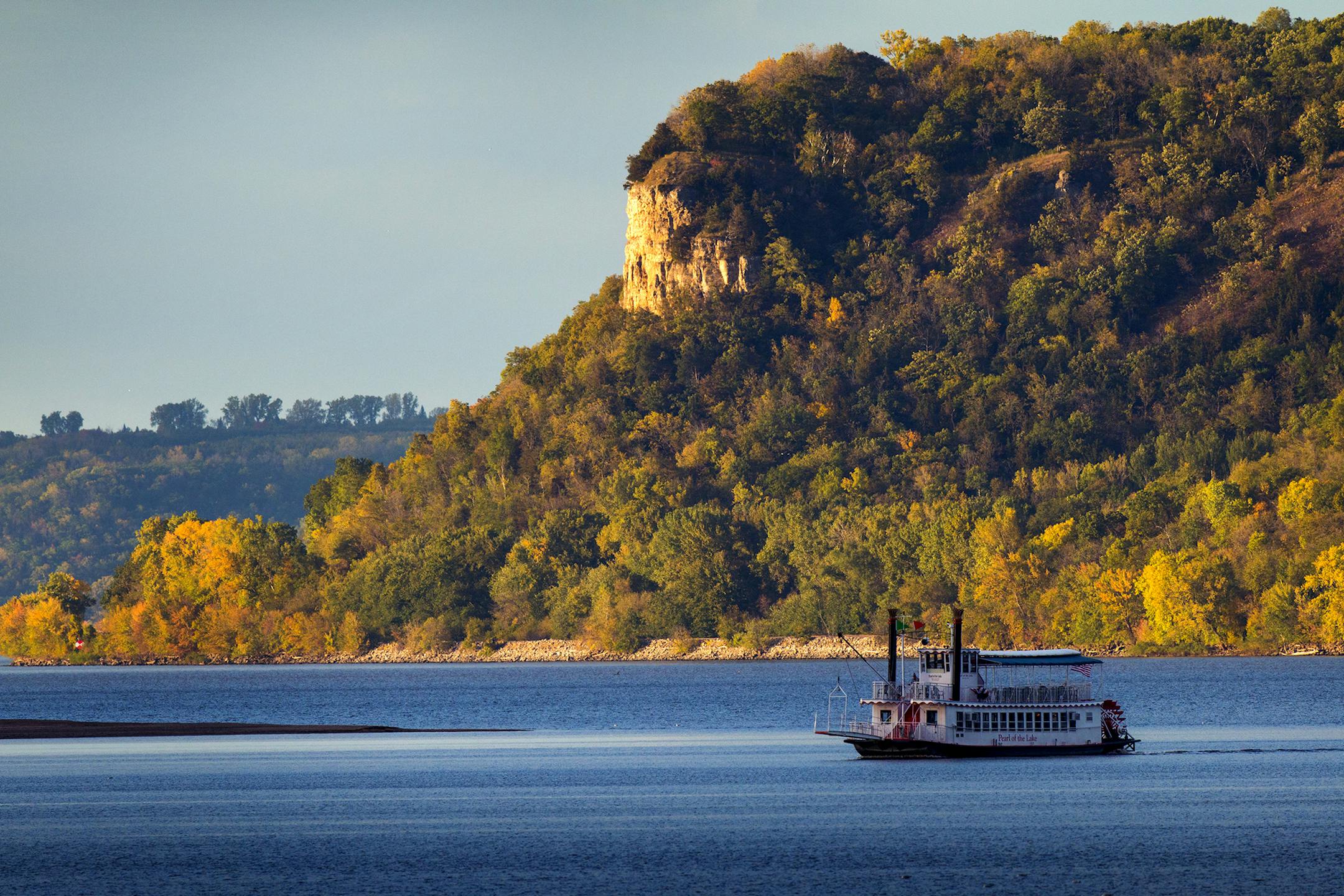 The1800's Paddle Wheel replica "Pearl of the River" cruises the shore of Lake Pepin on a early October evening.