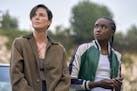This image released by Netflix shows Charlize Theron, left, and Kiki Layne in a scene from "The Old Guard," premiering July 10 on Netflix. (Aimee Spin