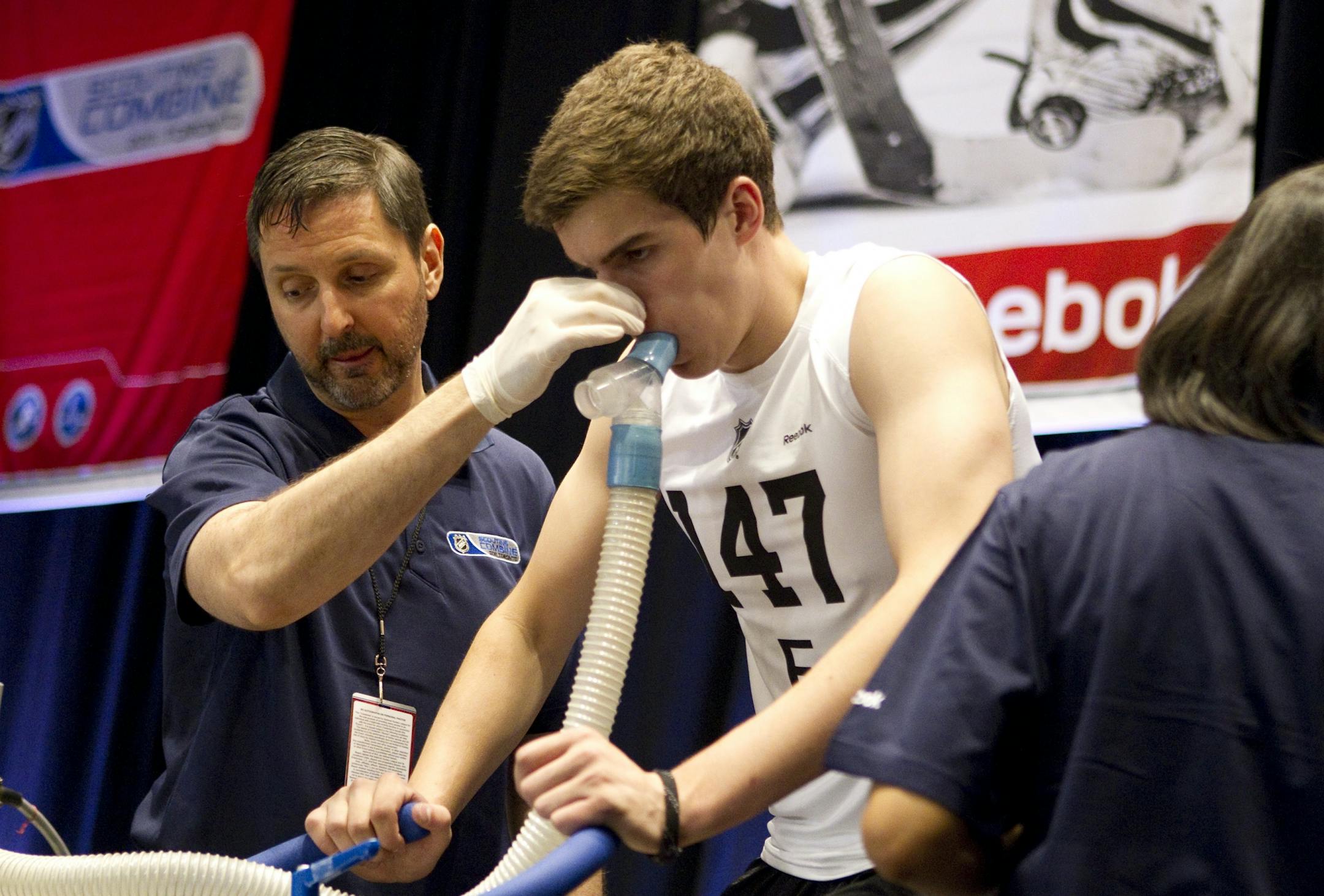 SPECIAL FOR MINNEAPOLIS STAR TRIBUNEDraft prospect Joseph Labate (centre) undergoes a physical test on a stationary bike during the NHL Scouting combine in Toronto on Friday June 3 , 2011.THE CANADIAN PRESS/Chris Young