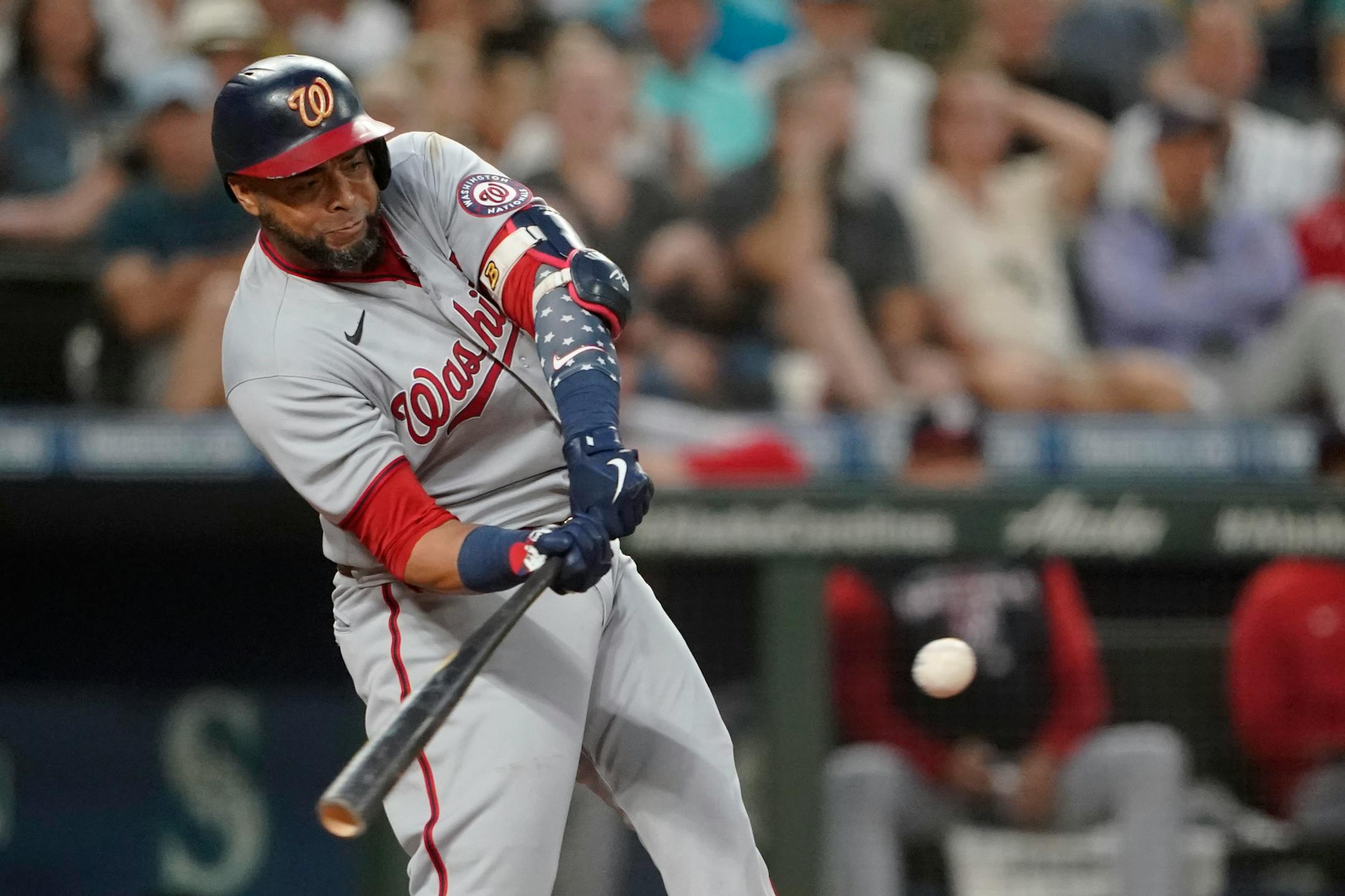 FILE - Washington Nationals' Nelson Cruz swings at a pitch during the team's baseball game against the Seattle Mariners, Aug. 23, 2022 in Seattle. Cruz has agreed to a $1 million, one-year contract with the San Diego Padres, according to two people with knowledge of the deal. The people spoke with The Associated Press on condition of anonymity Wednesday, Jan. 11, because the contract is pending a physical and had not been completed. (AP Photo/Ted S. Warren, File)