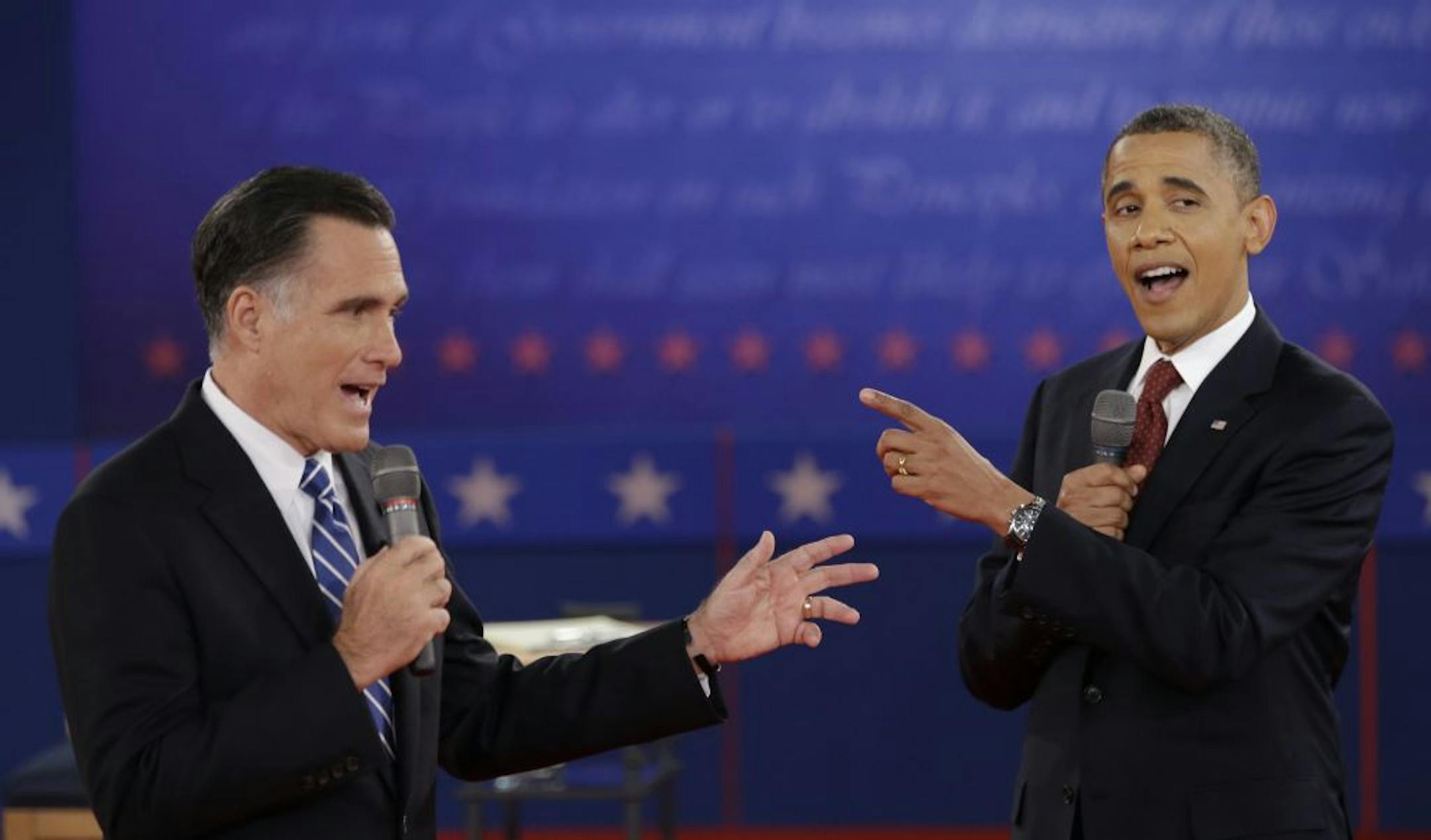 President Barack Obama and Republican presidential nominee Mitt Romney exchange views during the second presidential debate at Hofstra University, Tuesday, Oct. 16, 2012, in Hempstead, N.Y.