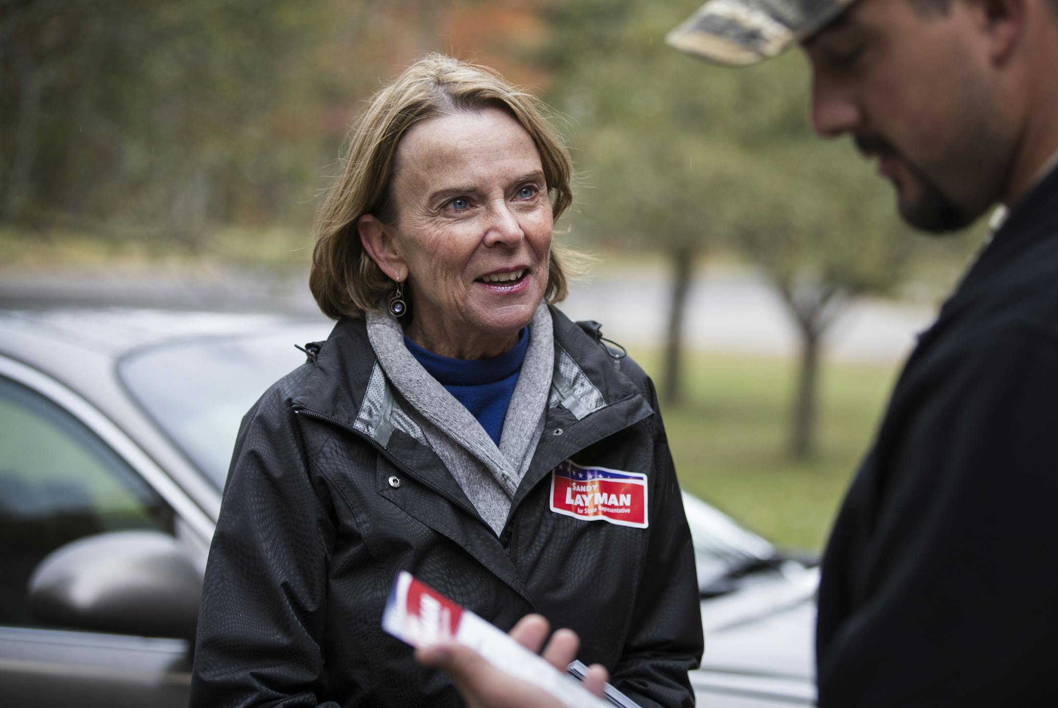 Sandy Layman, left, talks with Kyle Kleinendorst while door-knocking for her campaign in Grand Rapids. ] (Leila Navidi/Star Tribune) leila.navidi@startribune.com BACKGROUND INFORMATION: Sandy Layman, former IRRRB commissioner, campaigns for the Minnesota House of Representatives District 05B seat in Grand Rapids on Friday, October 7, 2016. The seat is currently held by Rep. Tom Anzelc, DFL-Balsam Township.
