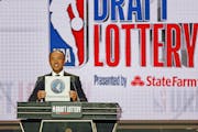 NBA Deputy Commissioner Mark Tatum announces that the Minnesota Timberwolves had won the eleventh pick during the NBA basketball draft lottery Tuesday