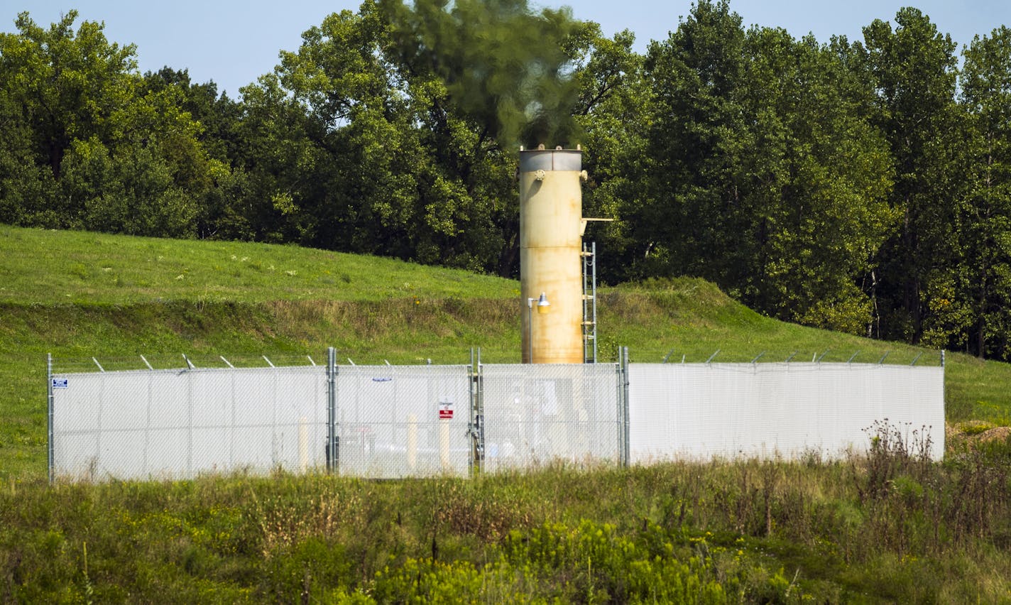 Excess methane is burned off. Walker Smith of the Minnesota Pollution Control Agency, which has converted several capped landfills into sites for solar arrays, is visiting its array near Lake Elmo.] Richard Tsong-Taatarii &#xef; richard.tsong-taatarii@startribune.com