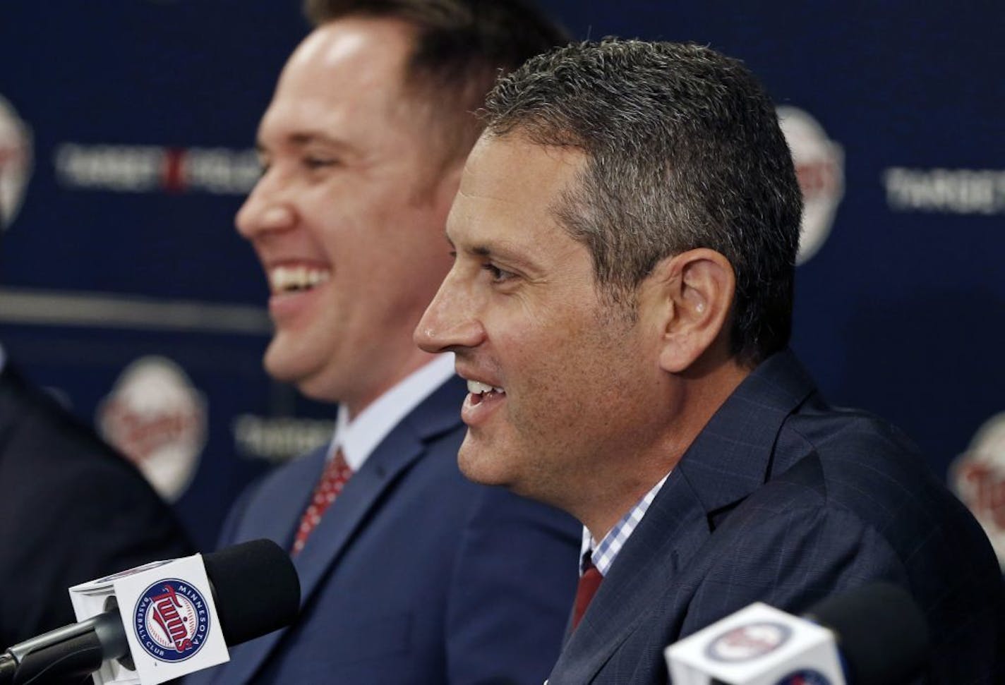 CORRECTS TAD TO THAD - Minnesota Twins new general manager Thad Levine, right, and new chief baseball officer Derek Falvey, enjoy a laugh during a news conference where they were introduced Monday, Nov. 7, 2016 in Minneapolis.