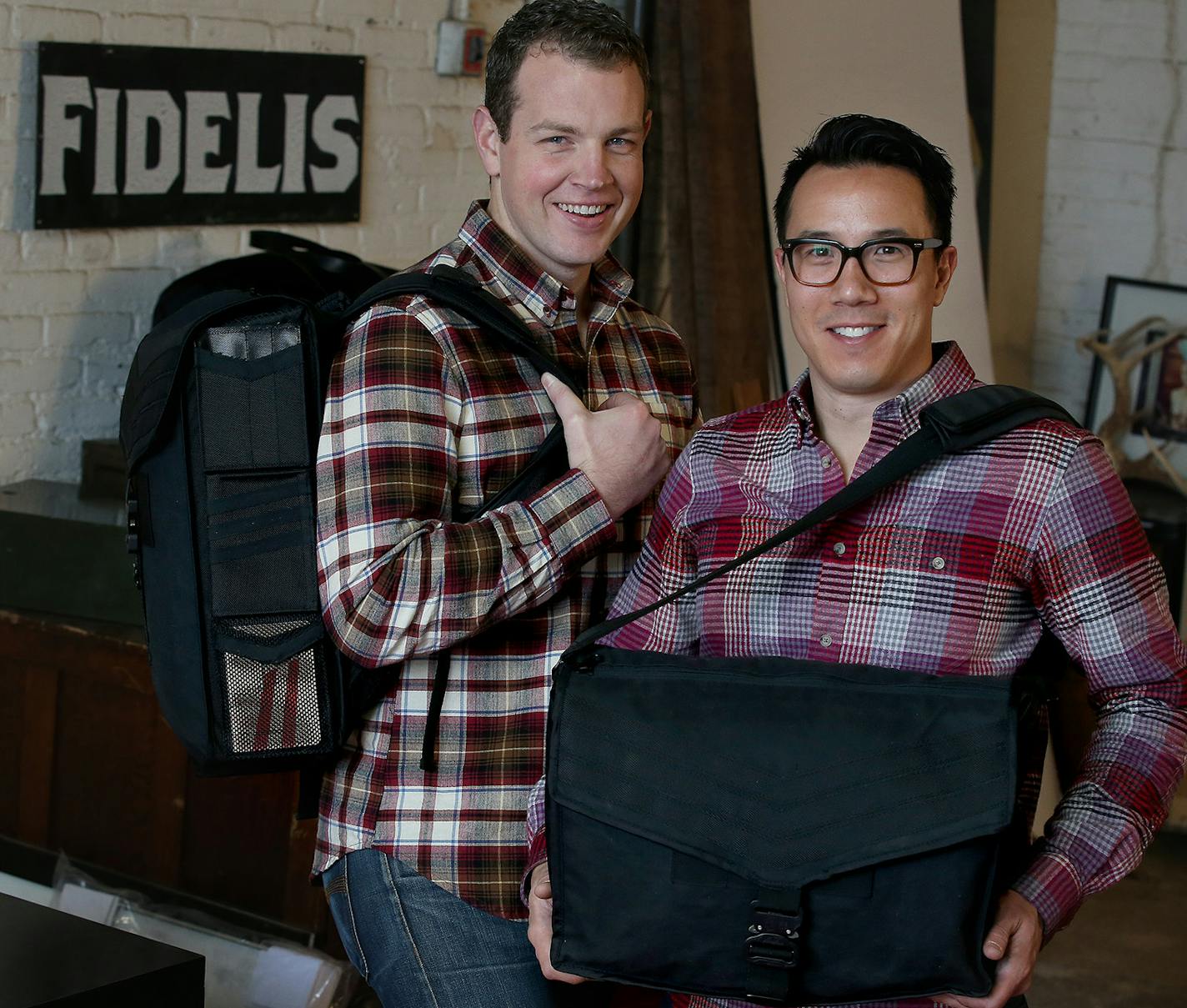 Tim O'Neil, left, and Brandon Jernigan recently introduced their new line of commuter bags at their northeast Minneapolis studio.