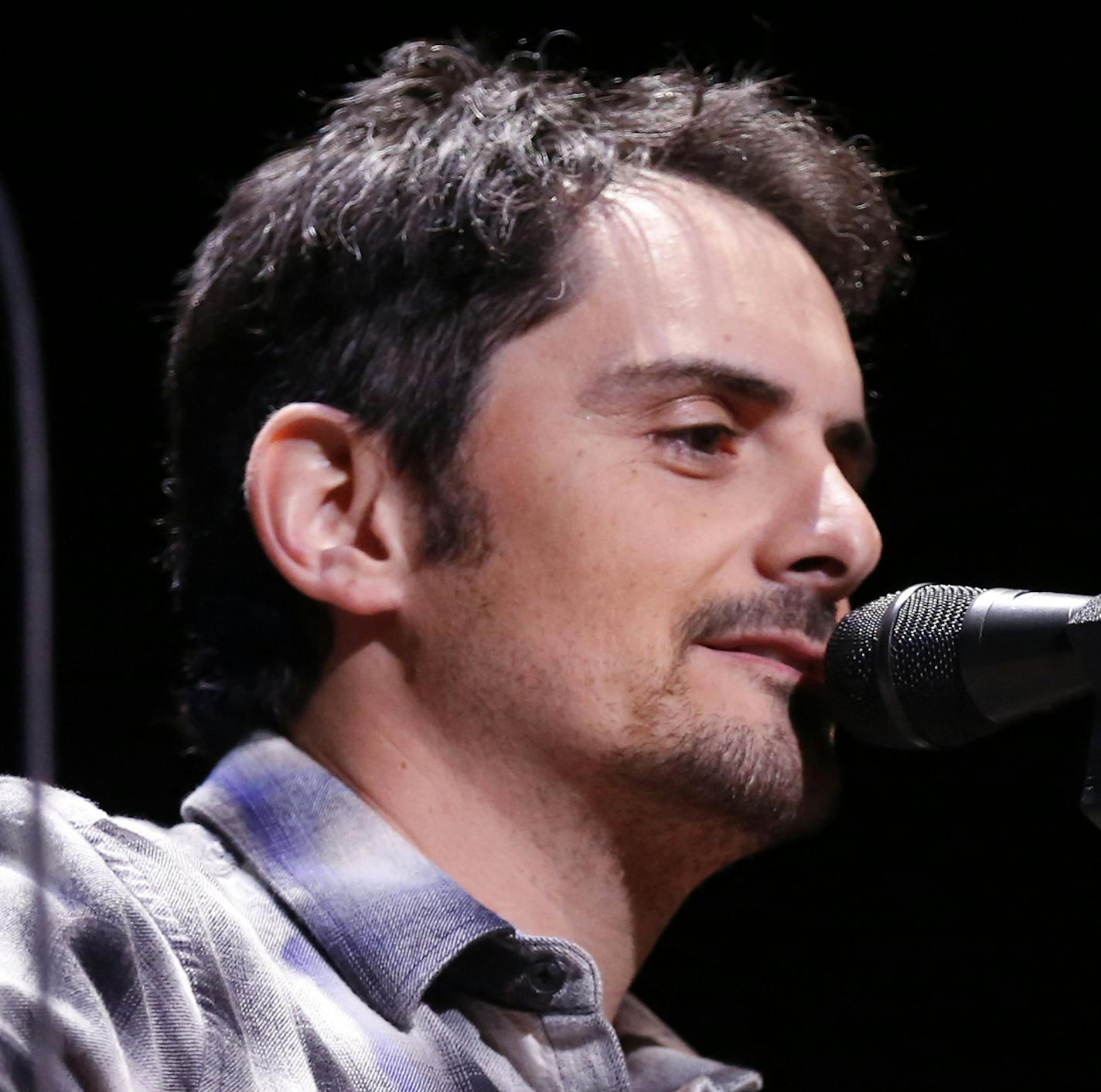 Brad Paisley, one of country music's big names, shows of his more intimate side at the Ryman shortly before embarking a nationwide tour that brings him to Minnesota on June 11. Paisley talks about the challenges of playing summer festivals, why he continues to write his own material and why Captain America kicks butt. [ TOM WALLACE &#xef; twallace@startribune.com INFORMATION: Paisley blends Southern rock into his traditional country material.