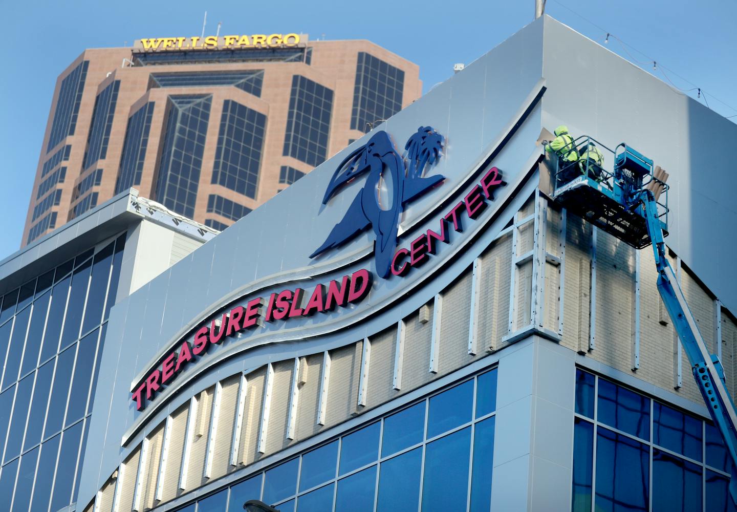 The Treasure Island Center building had their Grand Opening Event Tuesday, Jan. 16, 2018, in St. Paul, MN. Here, workers were putting the finishing touches on the exterior of the new Treasure Island Center building.] DAVID JOLES &#x2022; david.joles@startribune.com A once neglected department store has been transformed and positioned to rejuvenate the center of downtown Saint Paul as the Treasure Island Center is opening.