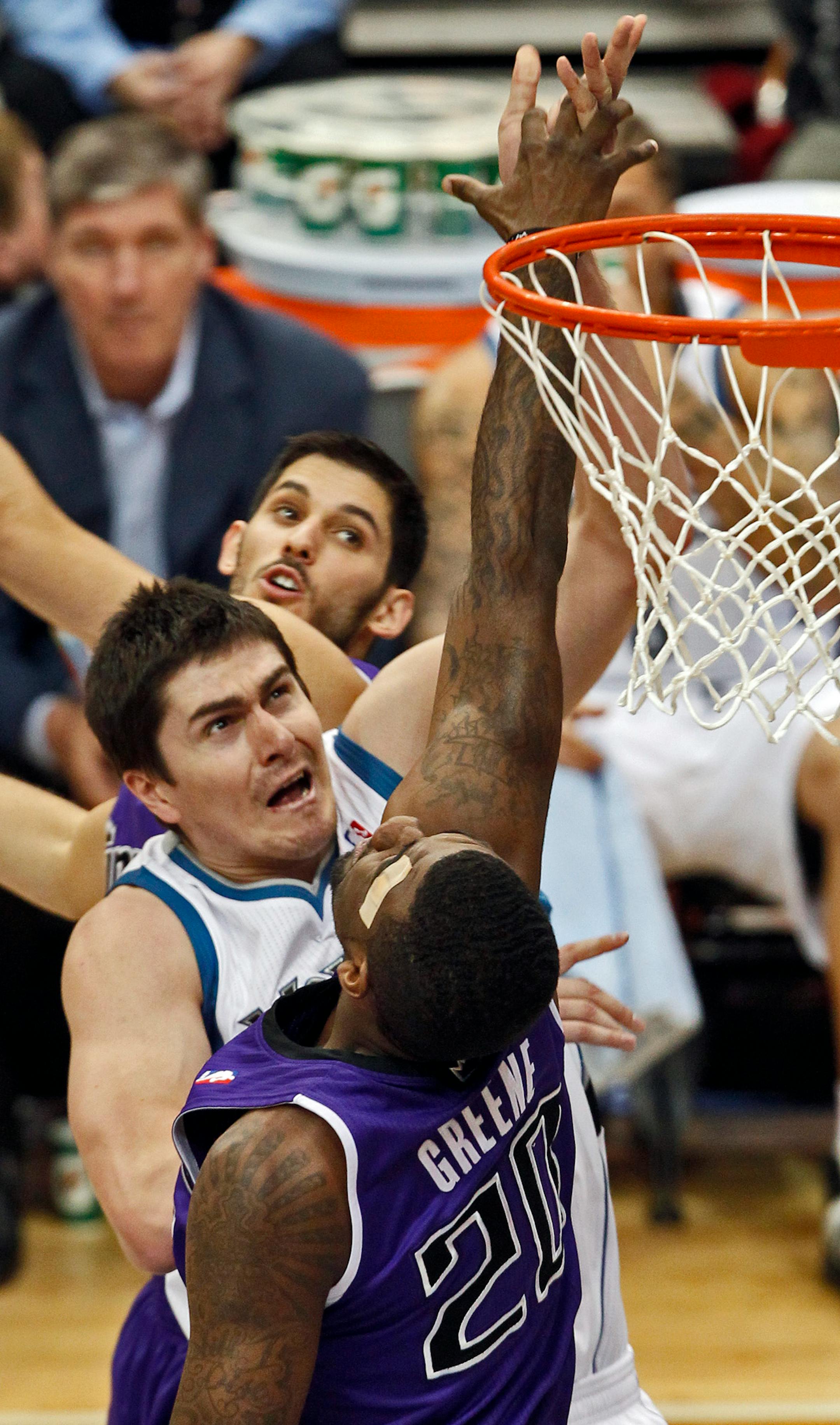 Wolves center Darko Milicic had little room to operate as Sacramento defender Donte Greene got a hand up on an early scoring attempt Sunday.