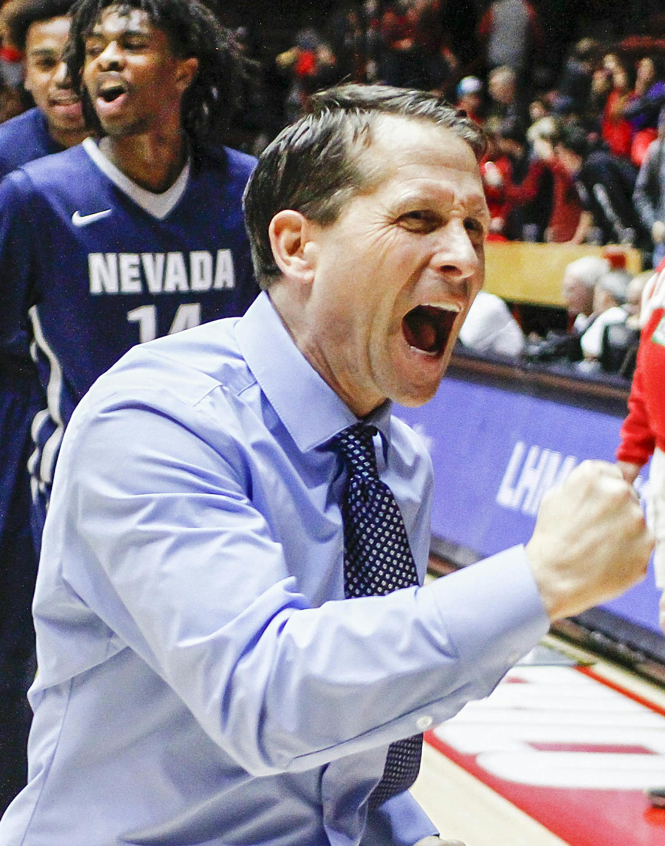 Nevada head coach Eric Musselman celebrates his team's win following the end of an NCAA college basketball game against New Mexico in Albuquerque, N.M., Saturday, Jan. 7, 2017. Nevada won in overtime 105-104. (AP Photo/Juan Antonio Labreche)