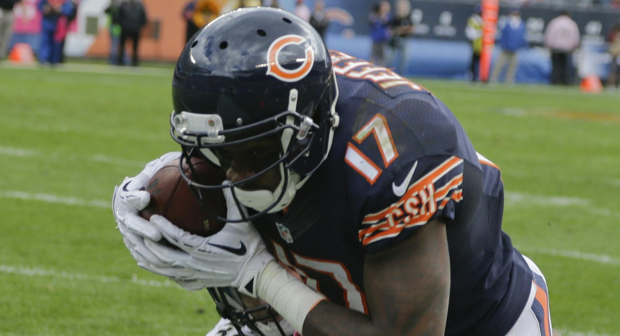 Chicago Bears wide receiver Alshon Jeffery (17) makes a catch against New Orleans Saints strong safety Kenny Vaccaro (32) during the second half of an NFL football game, Sunday, Oct. 6, 2013, in Chicago.(AP Photo/Nam Y. Huh)