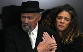 Louis Bellamy, the father of Lucas Bellamy, who died at the Hennepin County jail in 2022, was comforted by his daughter Sarah, Lucas’ sister, after