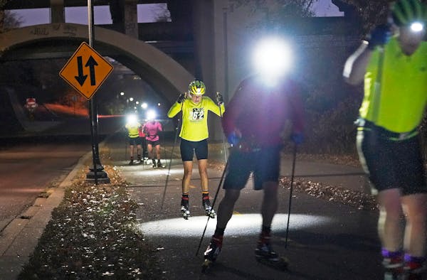 Cross country skiers with the Loppet Foundation did hill work on roller skis in lieu of any snow falling beneath the Franklin Avenue Bridge, as unseas