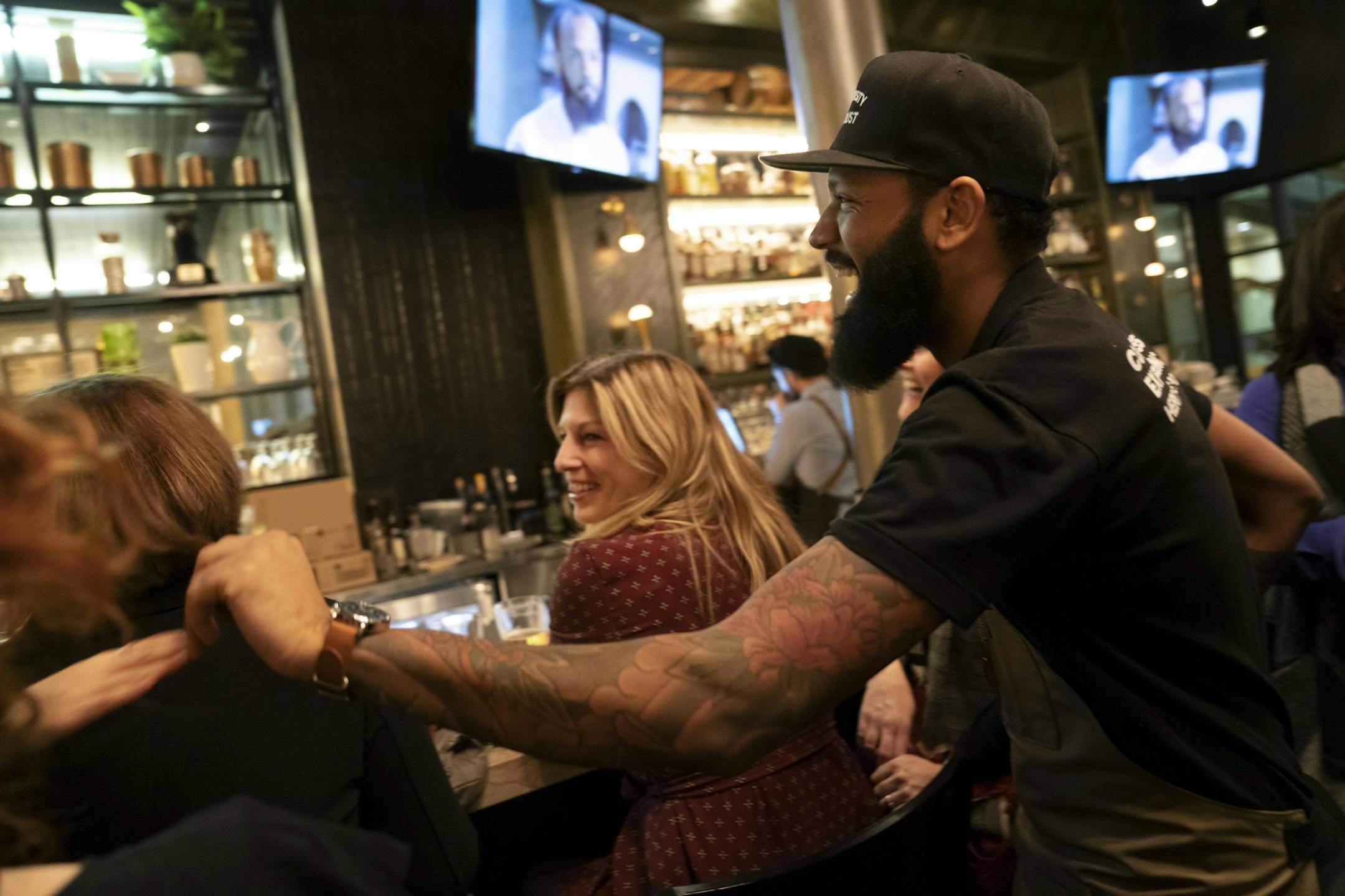 Chef and Top Chef contestant Justin Sutherland laughed with guests of his restaurant the Handsome Hog in St. Paul, Minn., as they watched Top Chef on the restaurant televisions on Thursday, January 17, 2019.