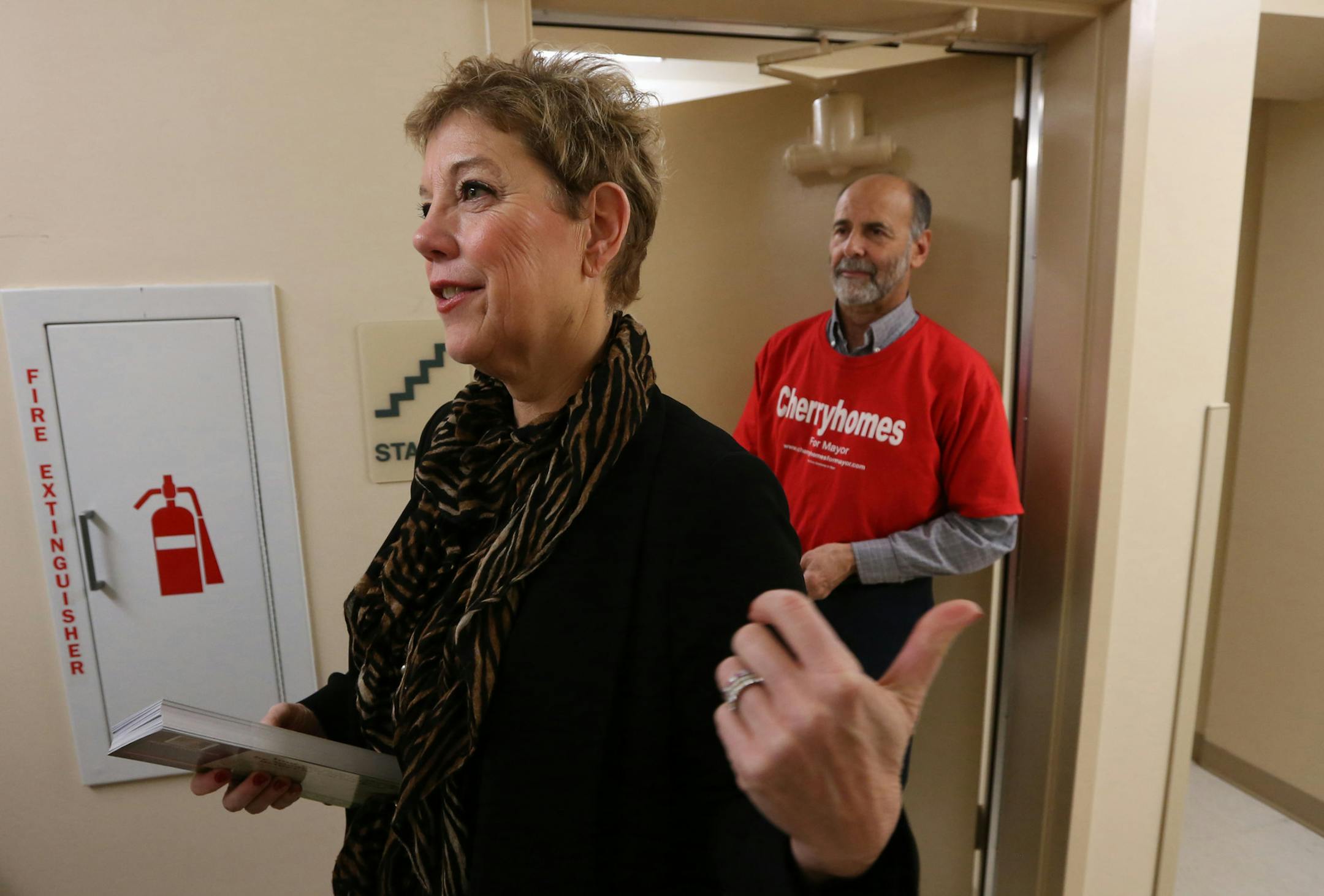 Jackie Cherryhomes: The former City Council member, left, and volunteer Billy Binder went door to door at the Art Love Manor residence.