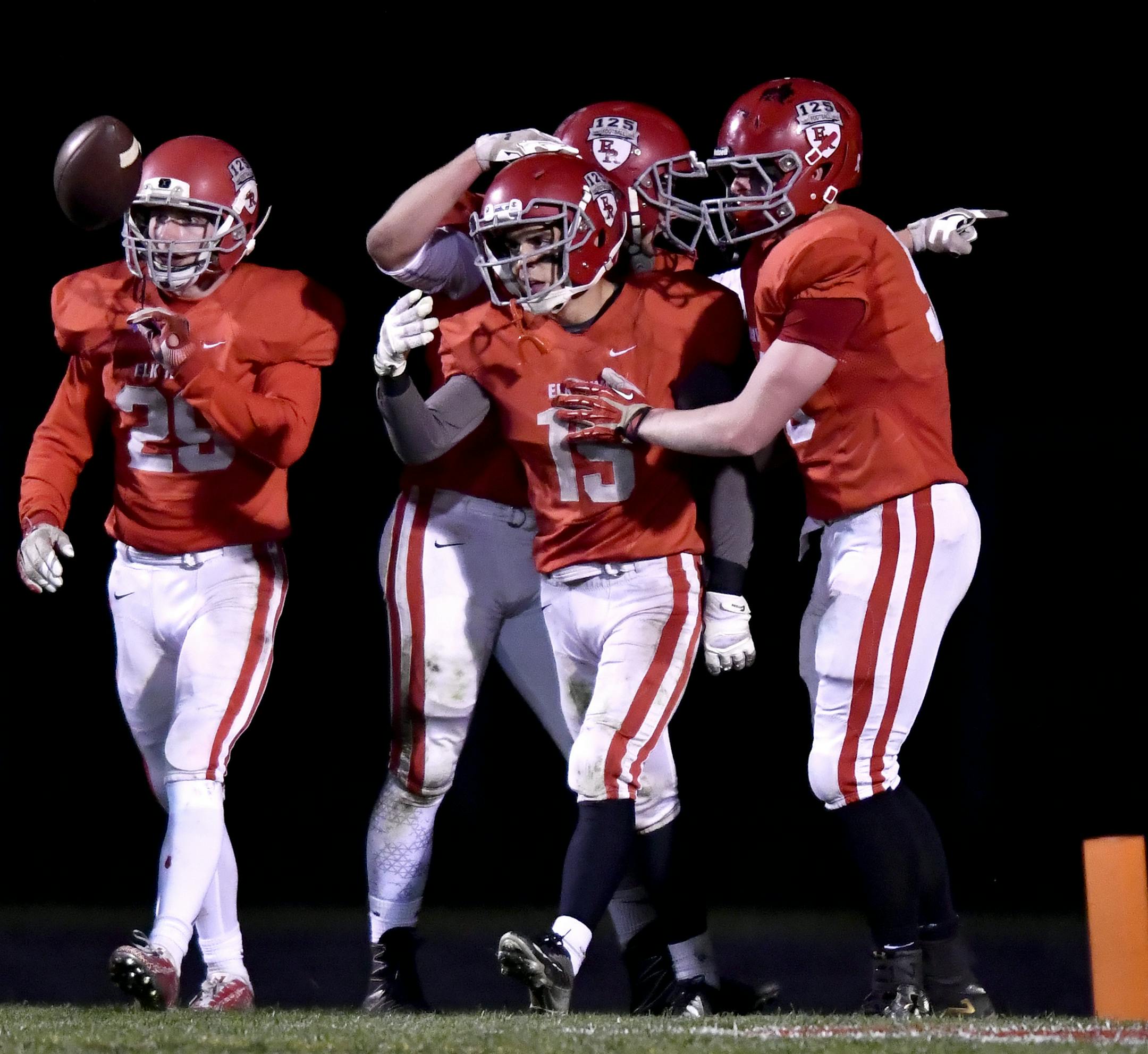 Elk River players celebrated with running back Sam Gibas (15) after a first quarter touchdown against Rogers Friday night. ] (AARON LAVINSKY/STAR TRIBUNE) aaron.lavinsky@startribune.com Elk River played Rogers in a 5A football game on Friday, Oct. 7, 2016 at Elk River High School.
